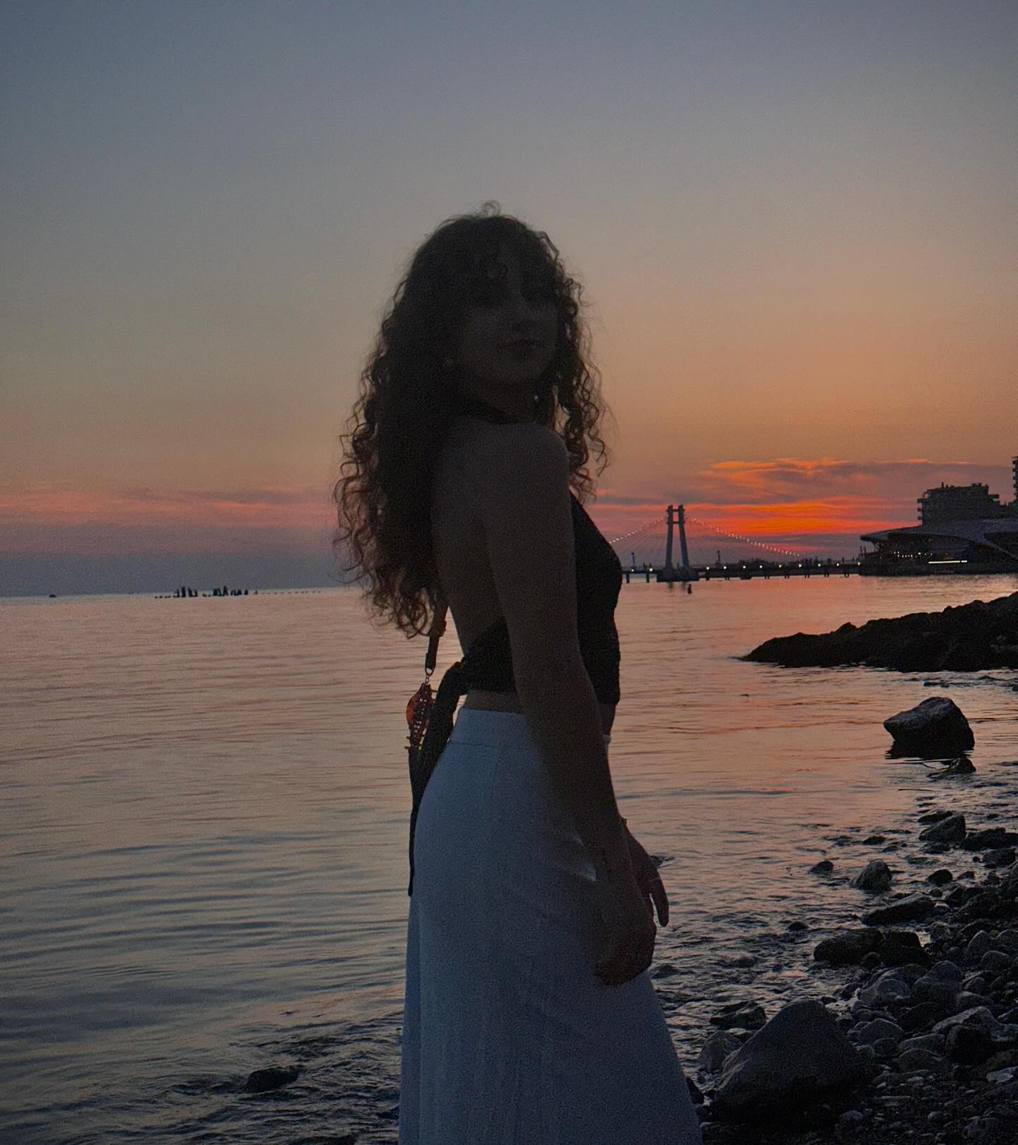 Maja by the water at sunset