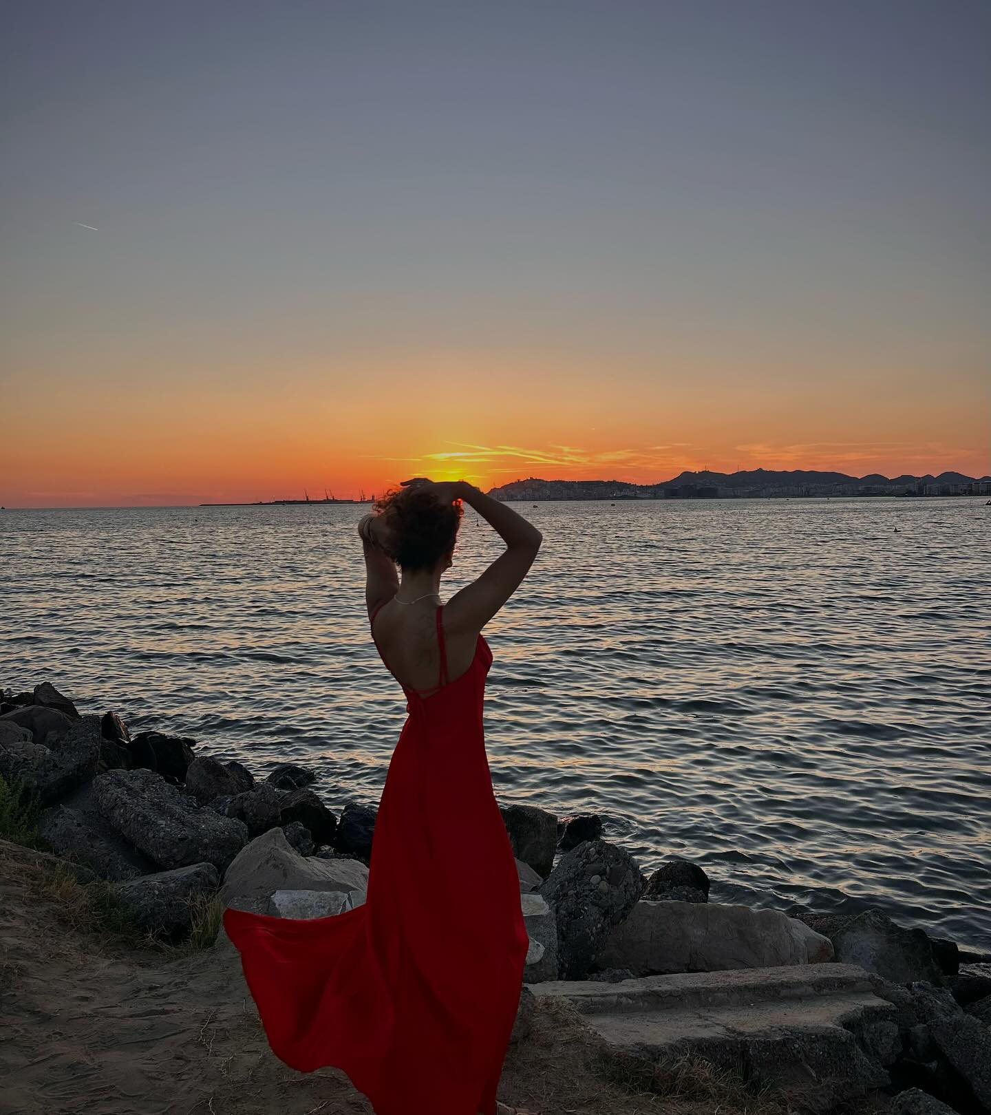 Maja by the water at sunset