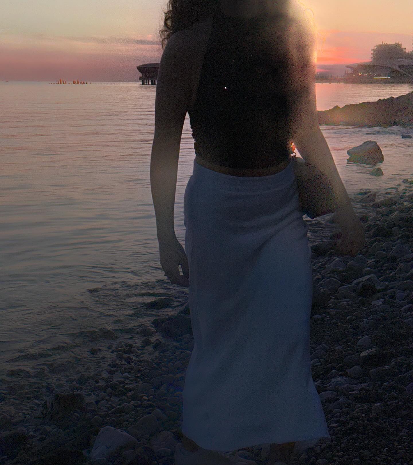 Maja by the water at sunset